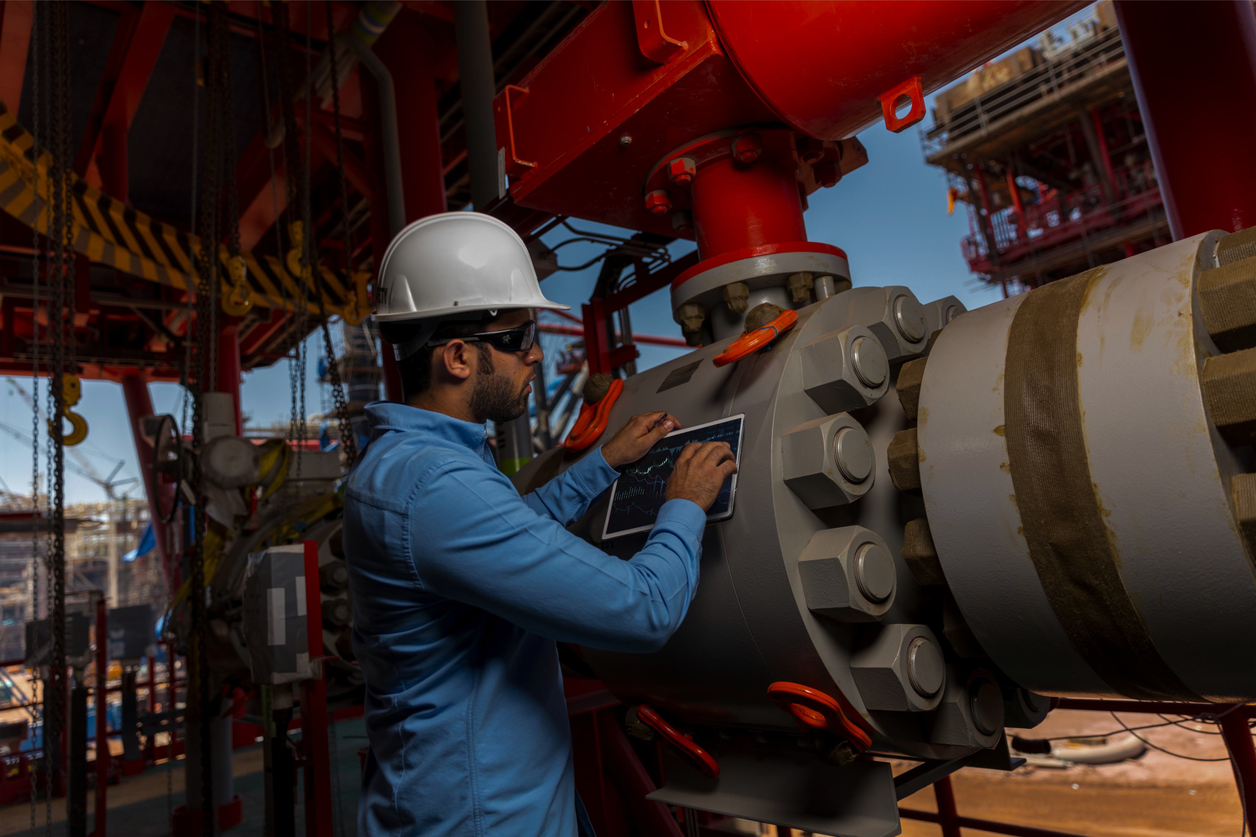 NMDC Energy specialist inspecting equipment offshore