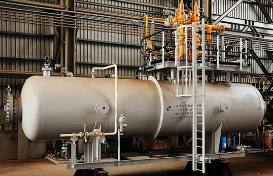 Storage tank pressure vessel in a fabrication workshop